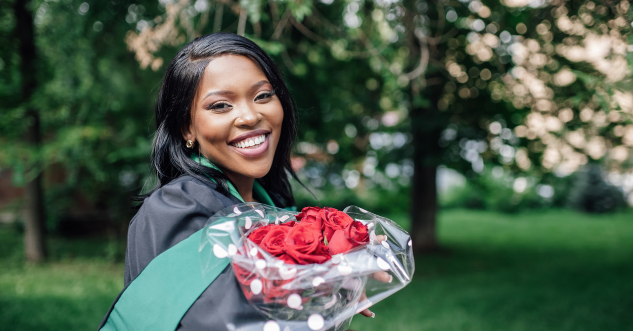 female graduate sunlight joyful