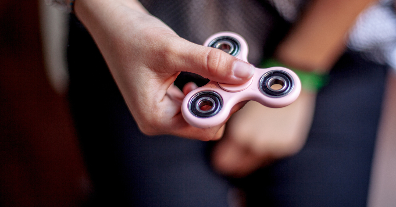 Woman Holding Fidget Spinner