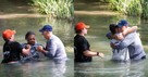 31 College Football Players from Historic Program ‘Praise Jesus’ and Get Baptized in Creek