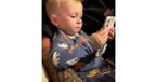 Toddler Tears up Looking at Pictures of His Parents