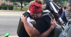 Police and Protesters Hug, Shake Hands after Officers Take a Knee in a Show of Solidarity