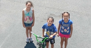 Children Raise Money One Cup at a Time to Buy Bikes for Their New Friends 