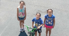 Children Raise Money One Cup at a Time to Buy Bikes for Their New Friends 