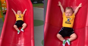 Little Guy Goes Down The Slide In Slow Motion