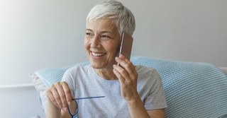 Happy woman talking on the phone