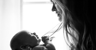 black and white photo of mom and baby