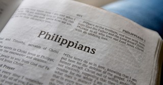 A Bible open to the book of Philippians