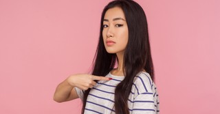 woman pointing to herself