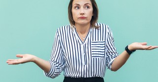 woman wondering questioning with hands up