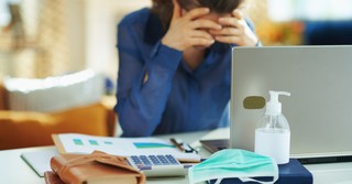 woman stressed at work desk