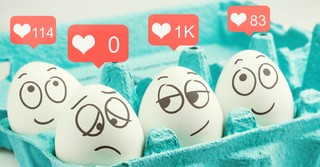 eggs with faces drawn on them, comparing social media likes