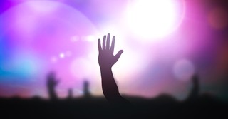 hand raised in praise at concert or performance celebrity idol worship, thou shalt have no other gods before me