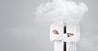 business man with head in clouds