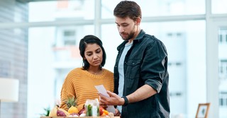 People looking at food and a receipt