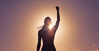 Woman raising her fist in the air