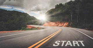 Road in the mountains that says start