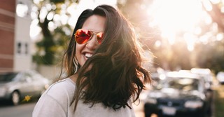 happy woman laughing walking on street