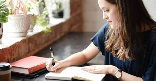 Young woman journaling, enoch