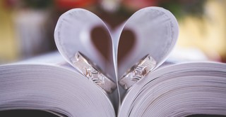 Wedding rings in a Bible