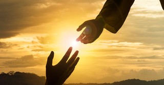 Hand of God reaching down to humanity