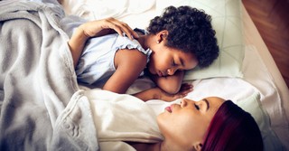Mom and child taking a nap together