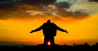 man kneeling in praise to God as Adonai
