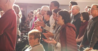 People worshipping in a church