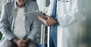 Doctor talking to an elderly patient