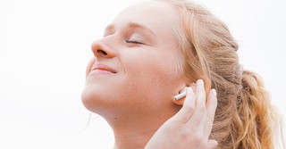 Woman peacefully listening to music