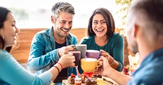 Friends clinking coffee mugs together, phileo love