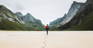 Man wandering toward the mountains