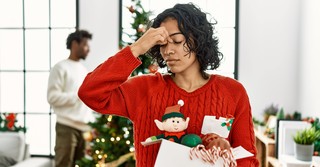 Woman stressed and overwhelmed at christmas