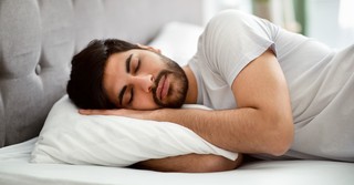 Man sleeping in bed