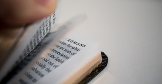 Book of Romans flipped open