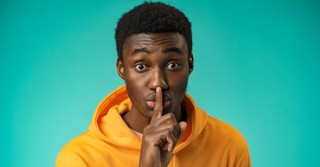 Man signaling to shush