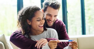 Man and woman with a positive pregnancy test