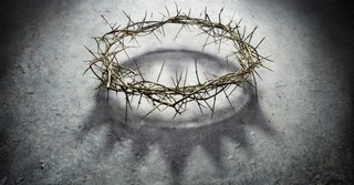 crown of thorns with a king's crown shadow