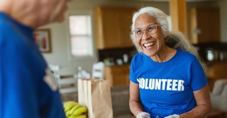 Smiling woman volunteering