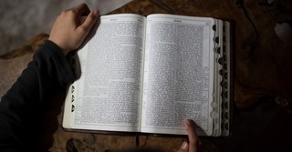 man reading Hebrew Old Testament