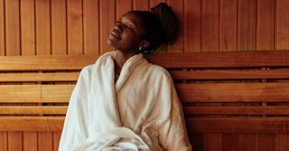 Peaceful woman relaxing at spa