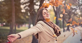 Woman and Leaves in Fall