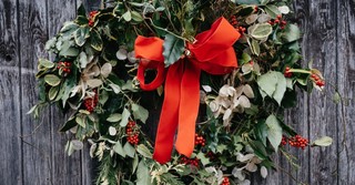 Christmas wreath on a front door; christmas traditions