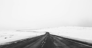 black and white road with snow