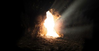 Light coming through the opening of an empty tomb