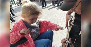 7-Year-Old Blind Girl With Autism Finds Joy In Street Busker's Music
