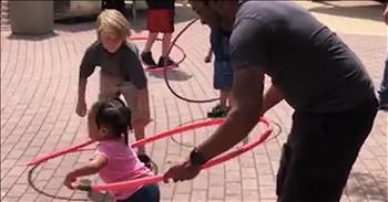 Amazing Dad Helps Toddler Hula Hoop On Her Own