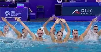 8 Synchronized Swimmers Step Up To The Side Of The Pool And Stun With Their 'Robot' Routine