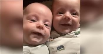 Mother Sings Hymn To Smiling Infant Twins