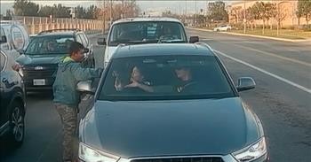 Act of Kindness Captured on Car’s Backup Camera in Traffic