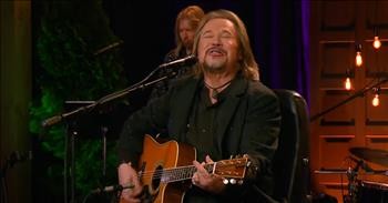 Travis Tritt Brings Energy To 'Uncloudy Day' Cover